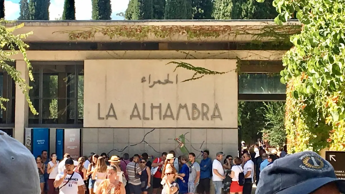 Visitors standing in line in front of the Alhambra’s ticket office Visitors standing in line in front of the Alhambra’s ticket office