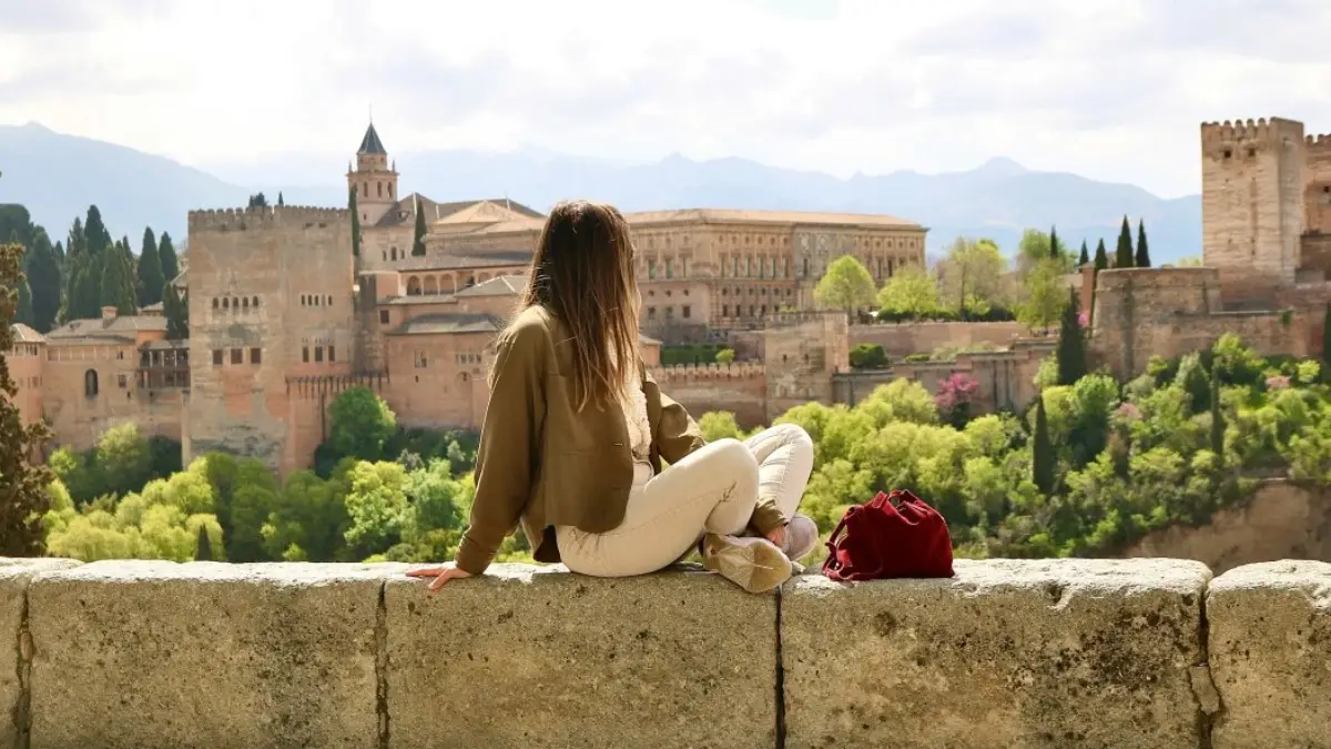 A tourist enjoying her Alhambra tour from Seville