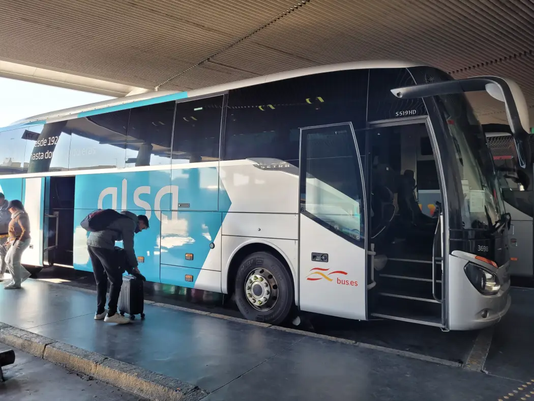 Travelers boarding the ALSA bus from Malaga to Granada