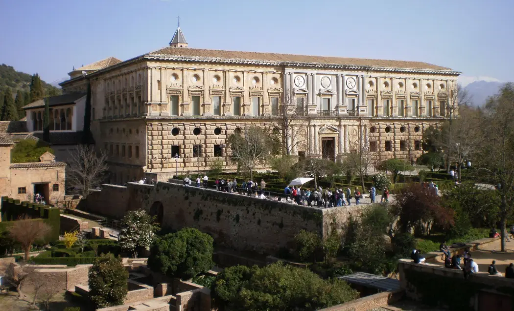 Tourists gathered outside the Palace of Charles V