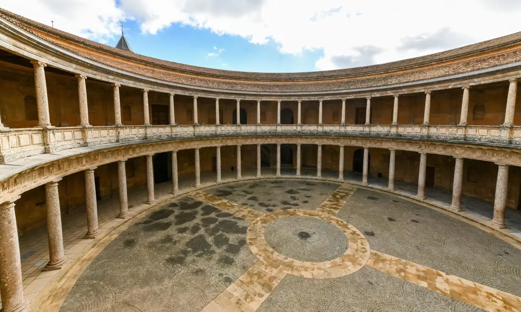 Circular courtyard with two levels of columns inside the Palace of Charles V