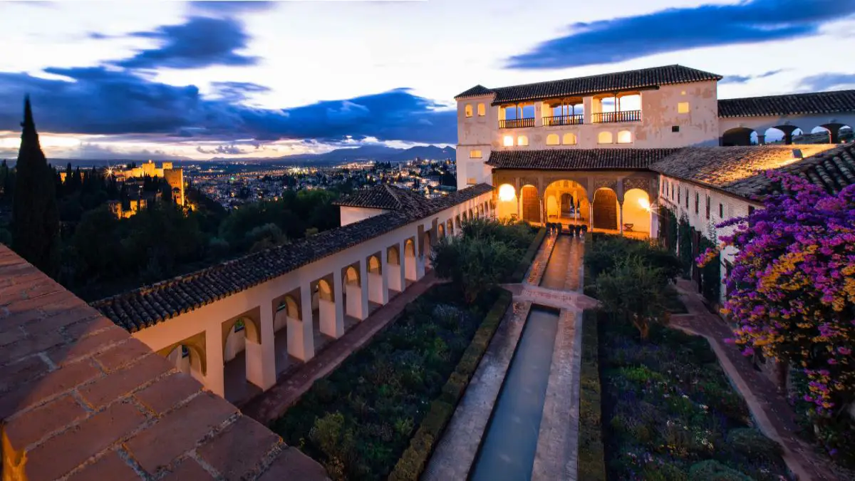 A breathtaking view of Generalife Palace and Gardens at night