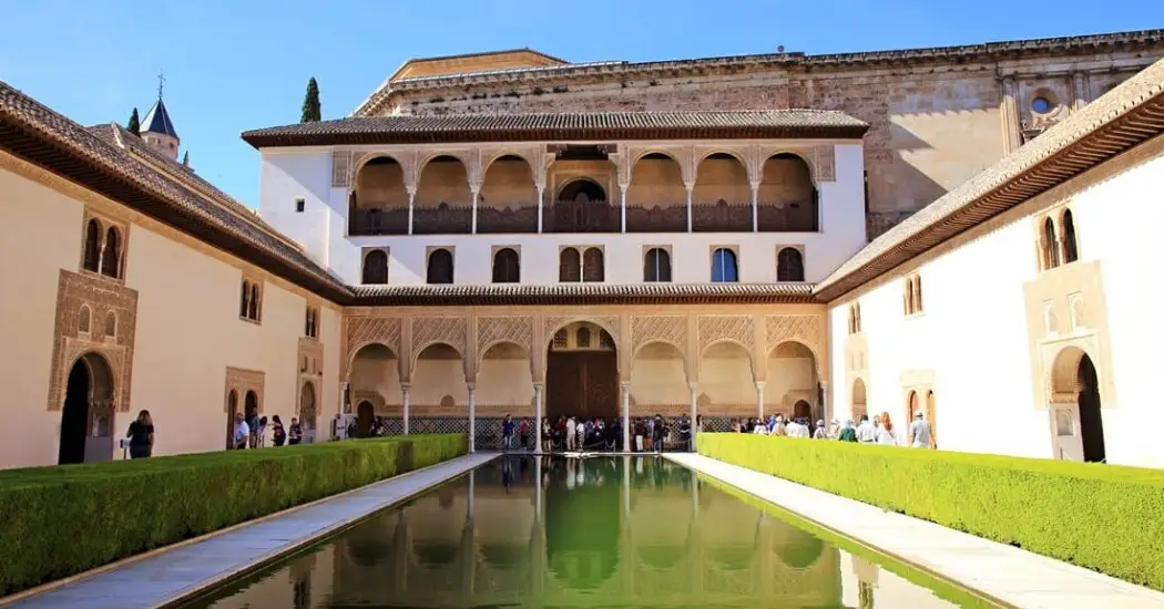 Tourists visiting Nasrid Palaces on a guided tour