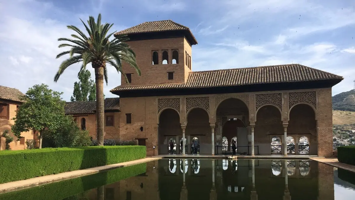 Tourists visiting the Nasrid Palaces on a self-guided tour